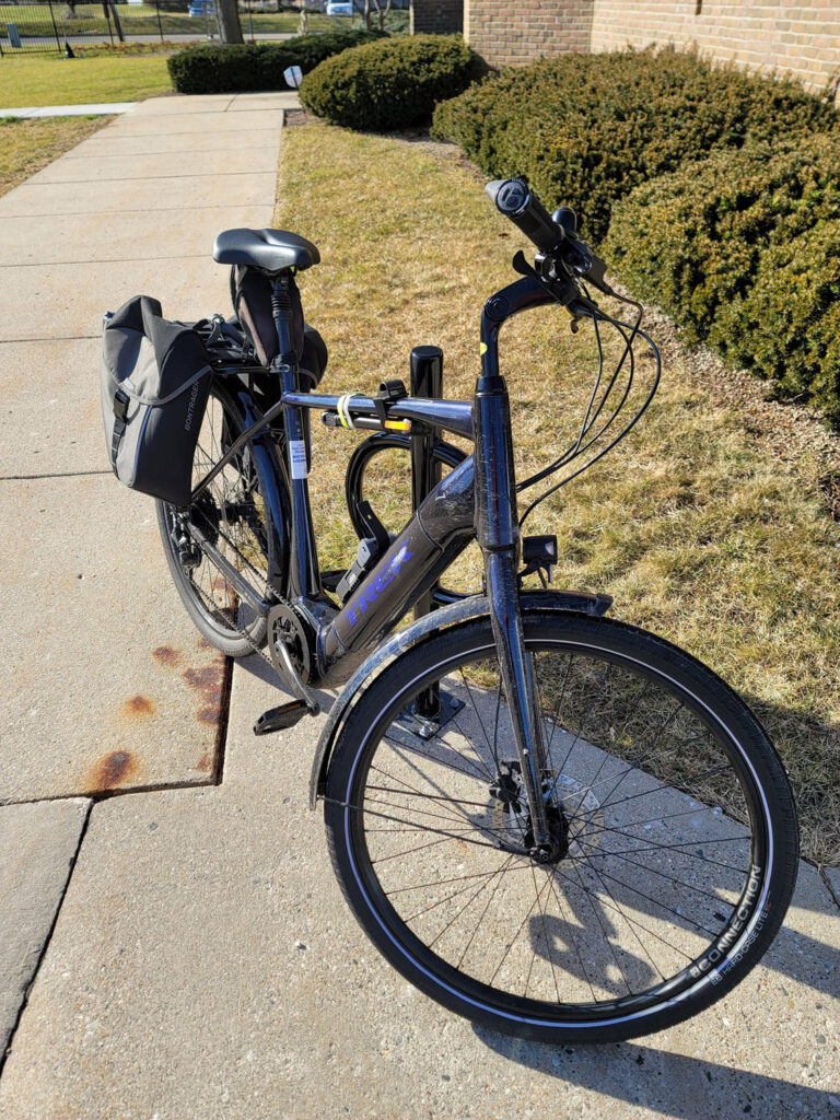 e-bike parked on sidewalk