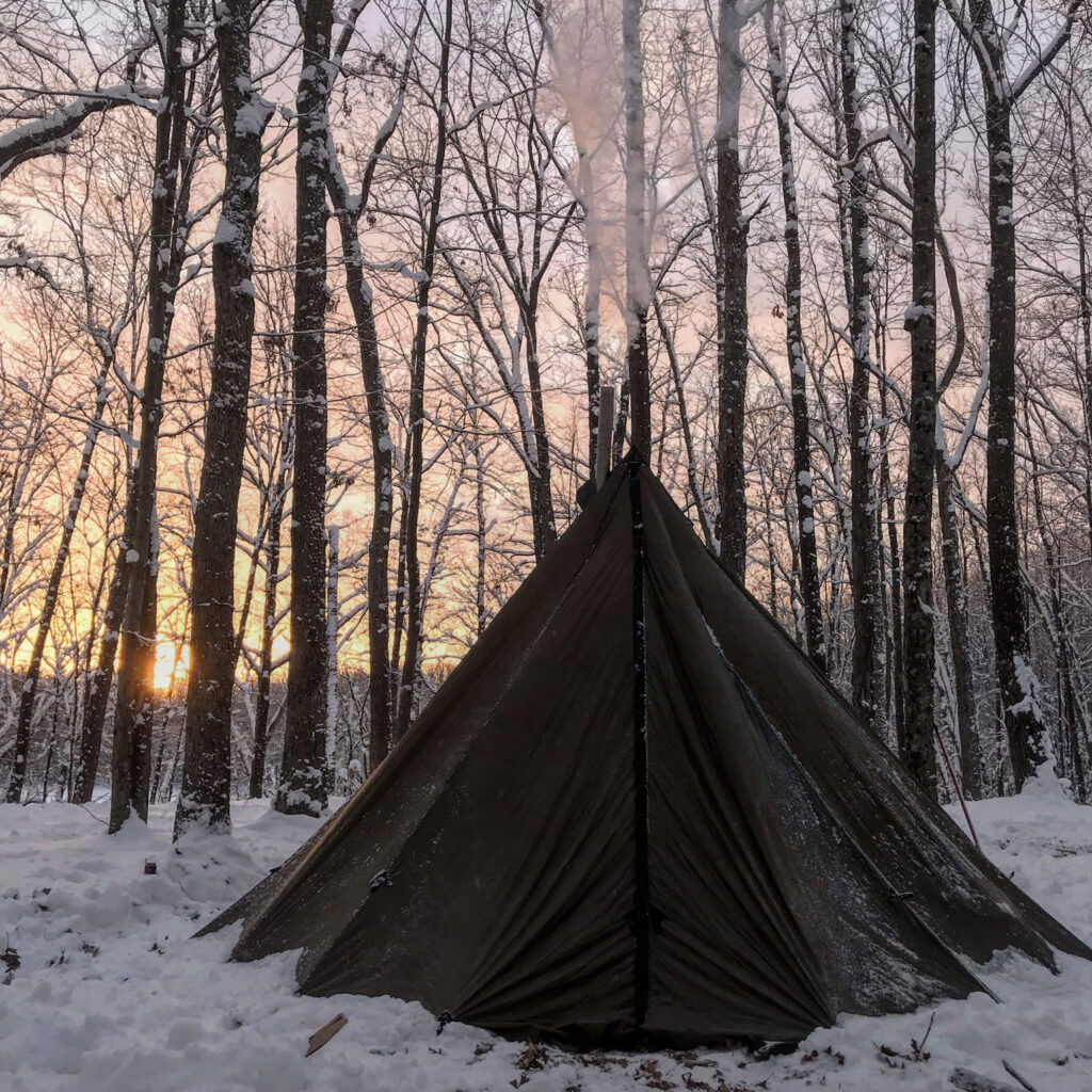 Tent with smoke from chimney coming out