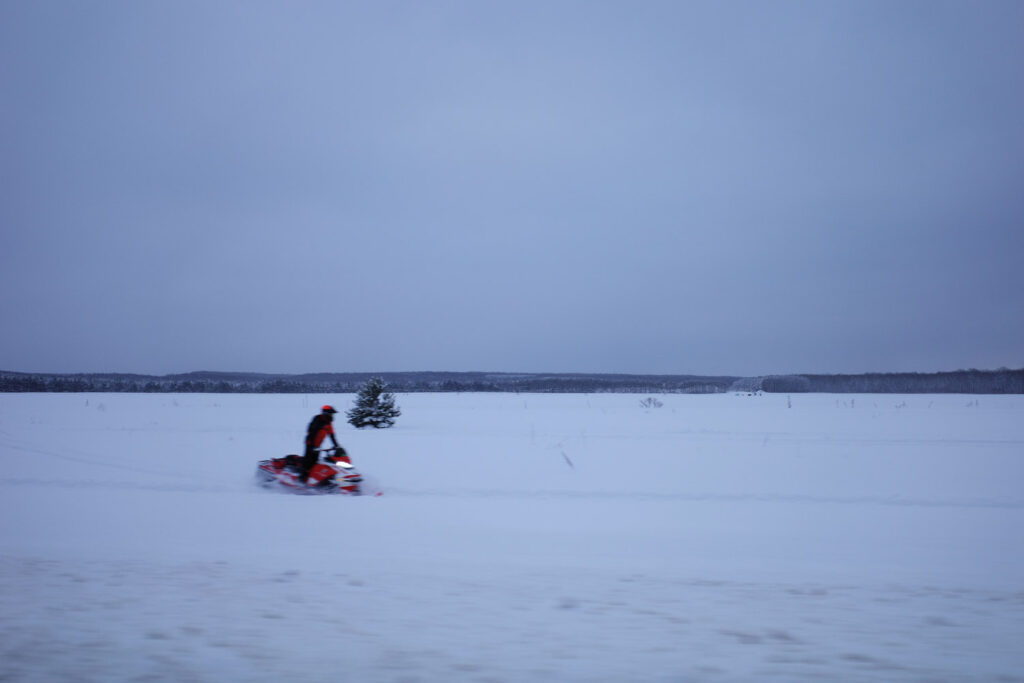 Snowy scene in Antrim county with snow mobile