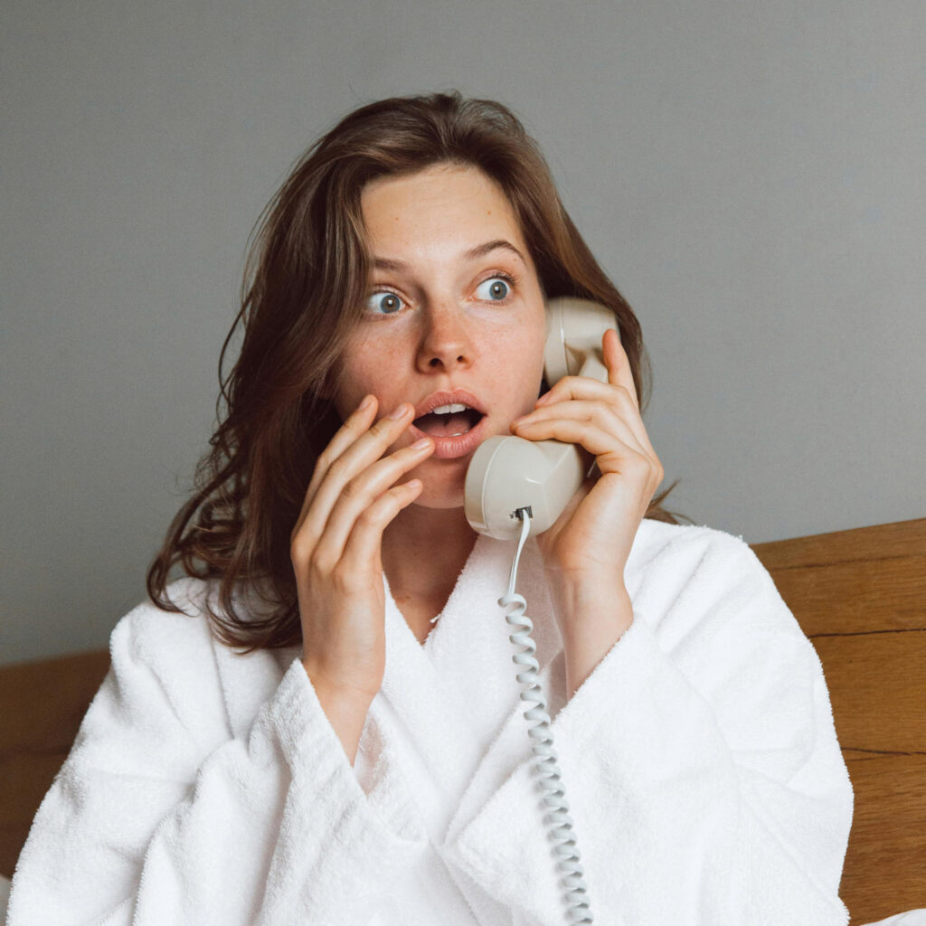 Girl in bathrobe on telephone