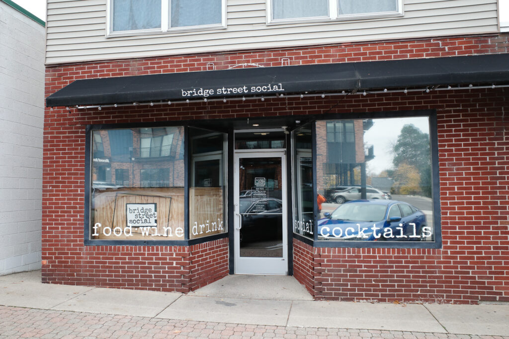 bridge street social, sign saying "food, wine, drink, social, cocktails"