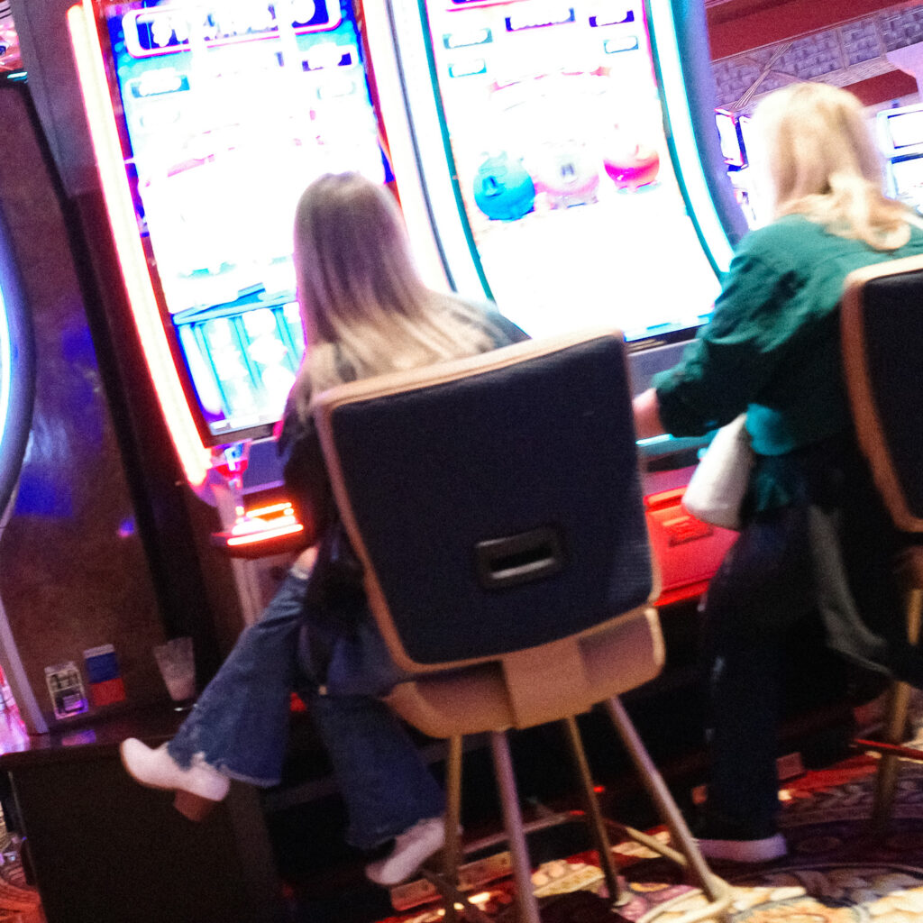 girls playing slots at casino