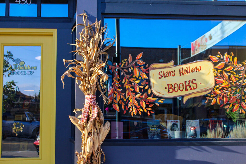 sign reading stars hollow books in window