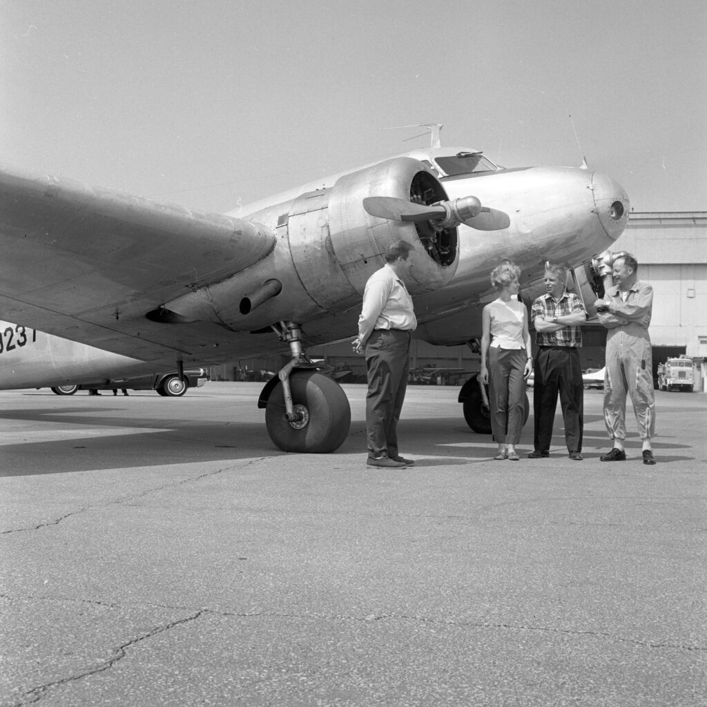 Anne Pellegreno with plane and crew