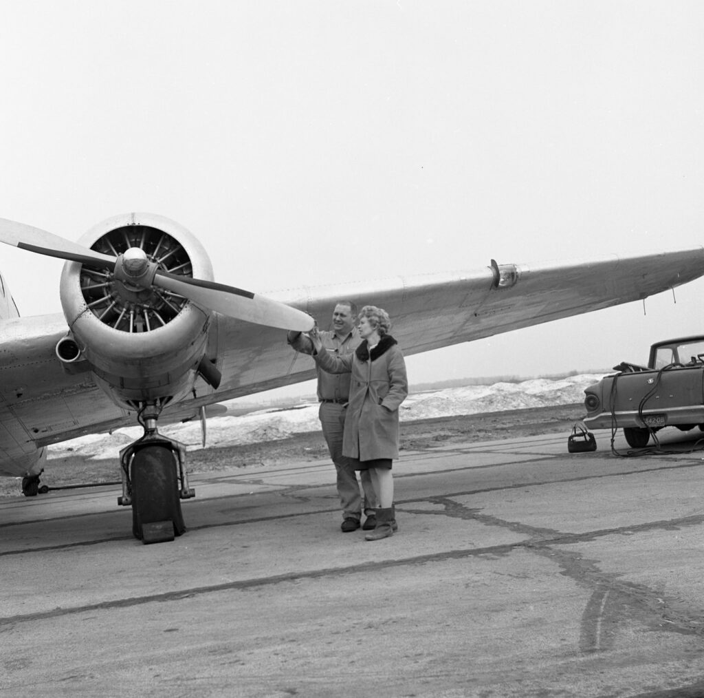 Anne inspecting plane propeller