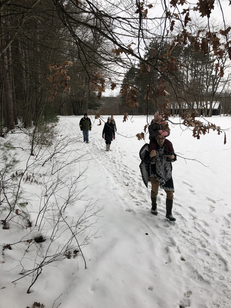 Family out looking for antlers in snow