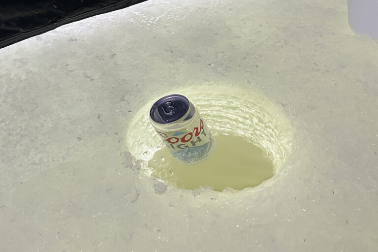 Coors light in hole in ice