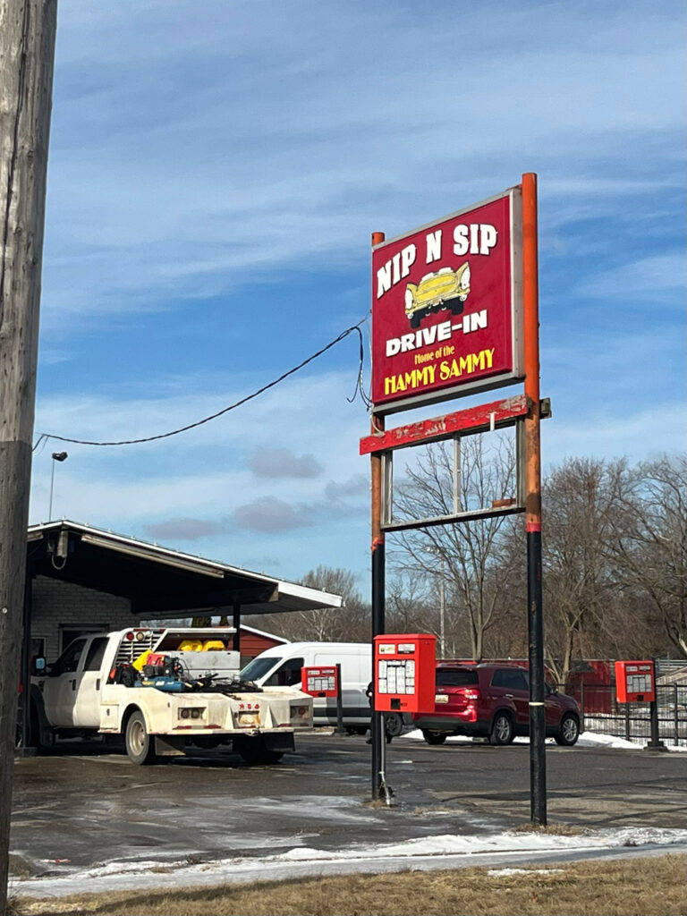 sign for nip n sip drive-in home of the hammy sammy