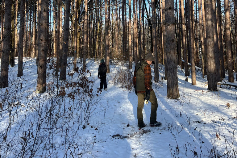 Men looking for antlers in snow