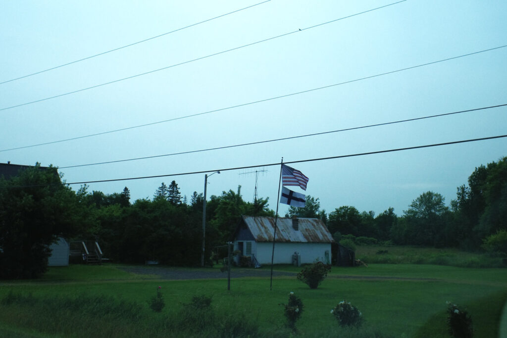 american and finnish flags flying