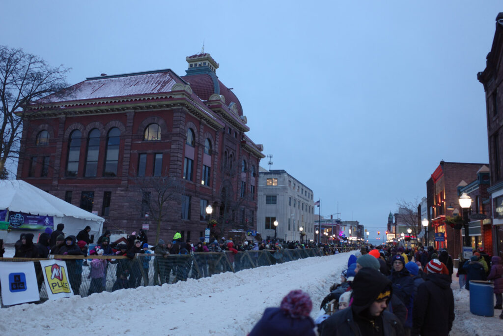 crowds on street in snow