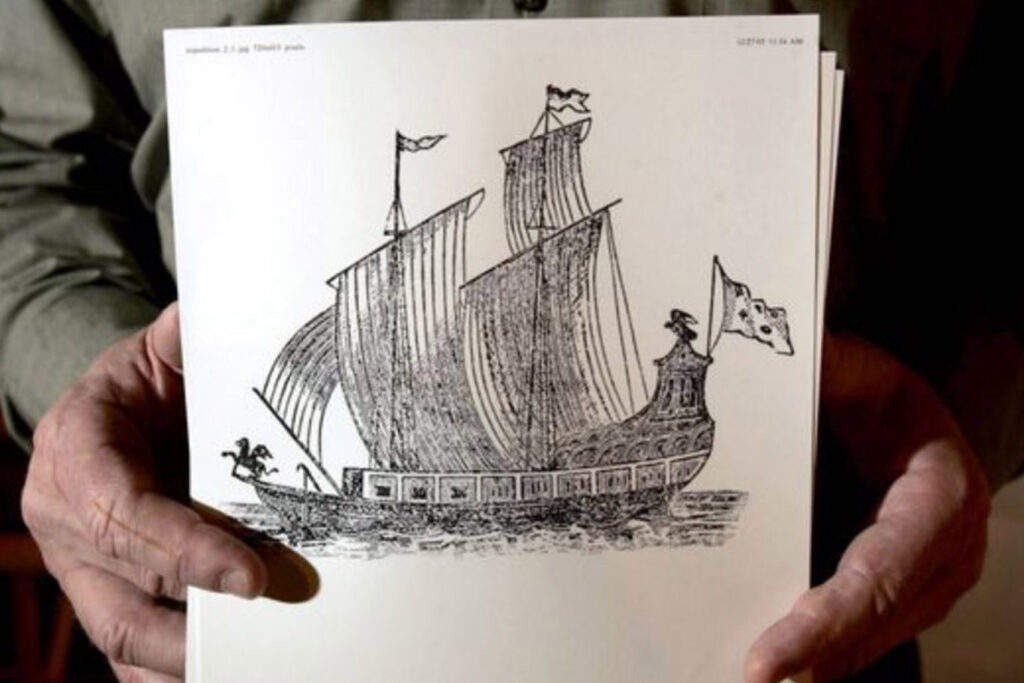 man holding image of ship