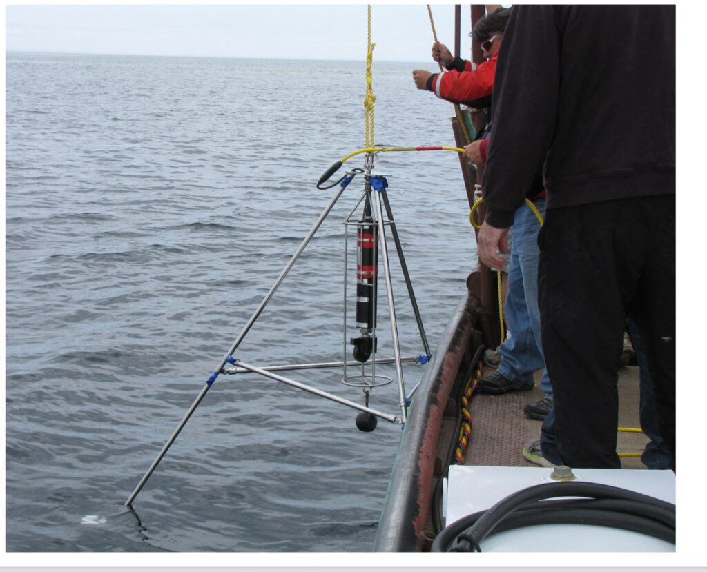 underwater imaging device hanging off boat