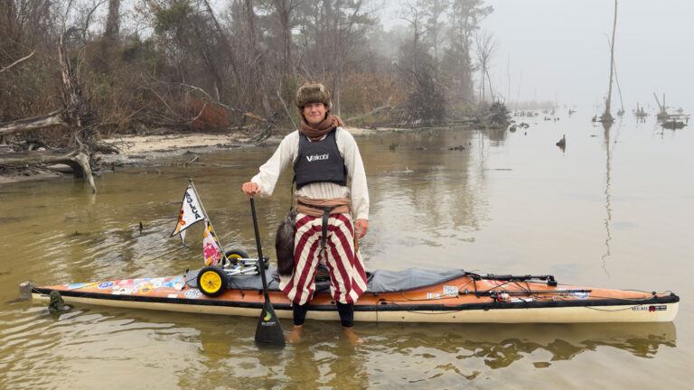 peter frank with canoe and striped pants