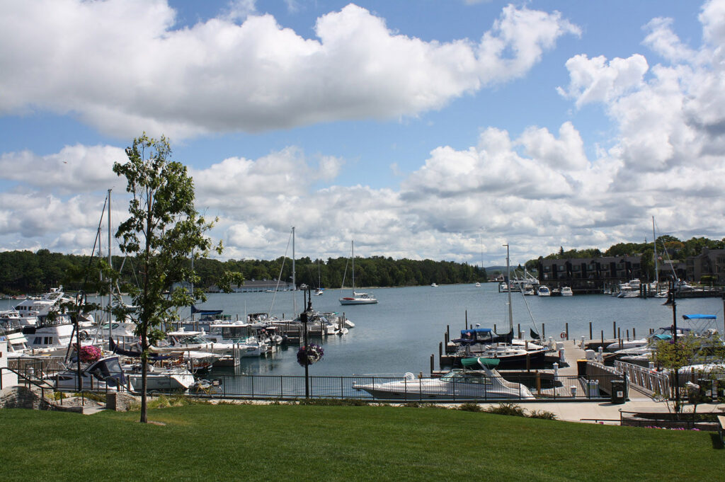 docks boats and lake in charlevoix