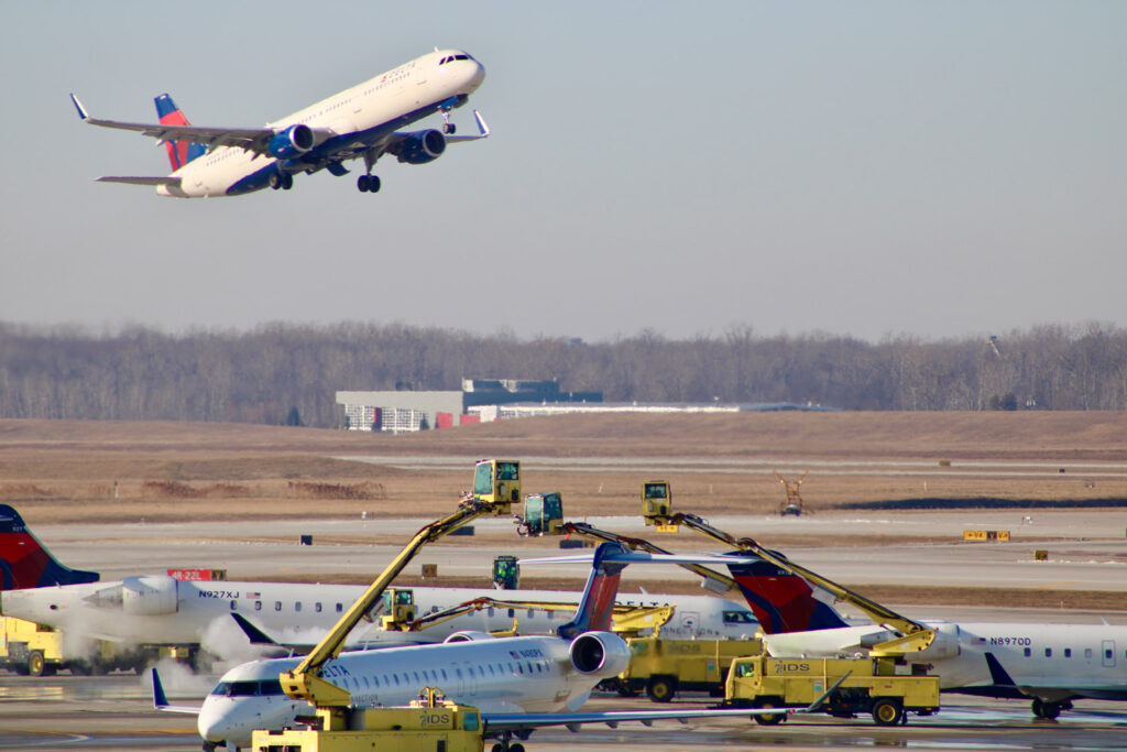DTW airport with plane taking off