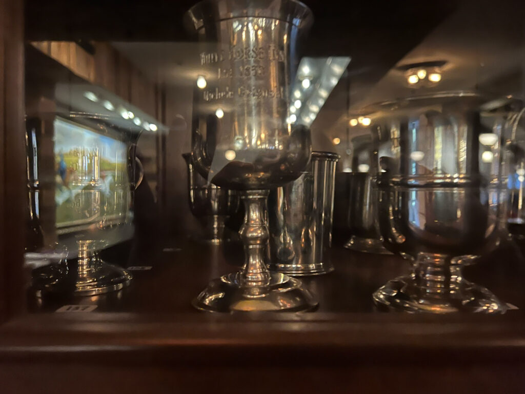 sterling silver cups with horse mural reflection