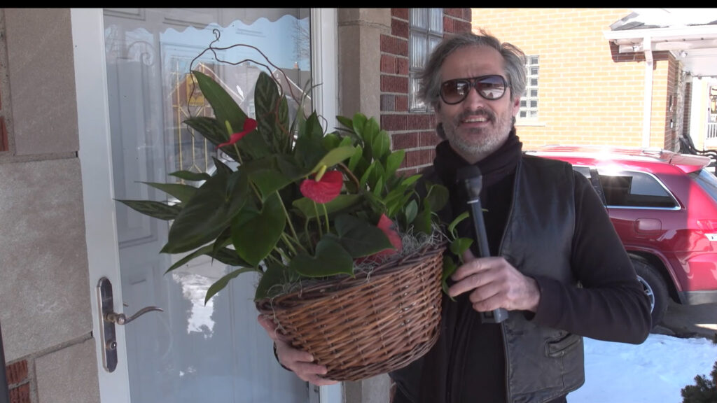 charlie at front door with flowers