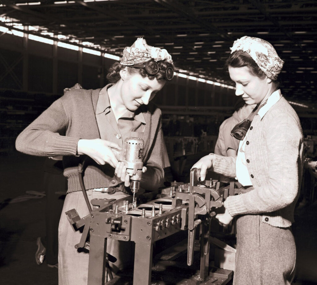 two women riveting aircraft parts