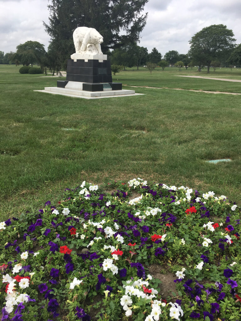polar bear statue and gravestones