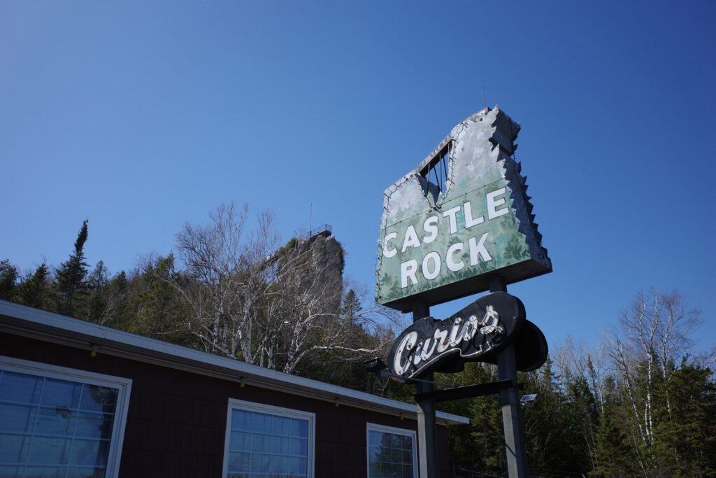 sea stack in st ignace with castle rock sign