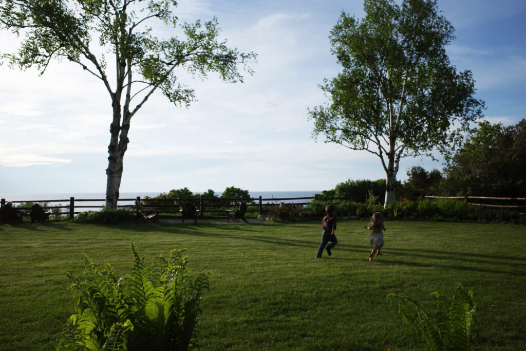 kids running on lawn at legs inn