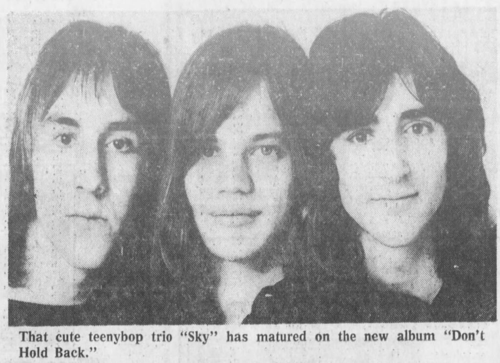 newsclipping with Sky band photo and caption reading "that cute teenybop trio Sky has matured on the new album don't hold back"
