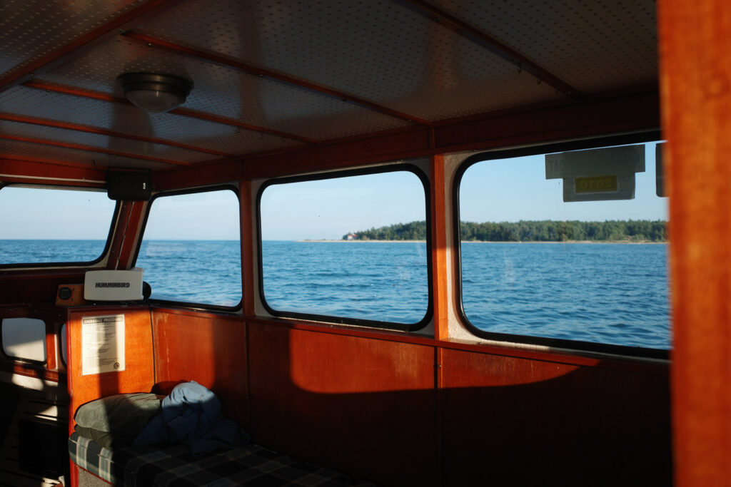 boating towards high island with ruins