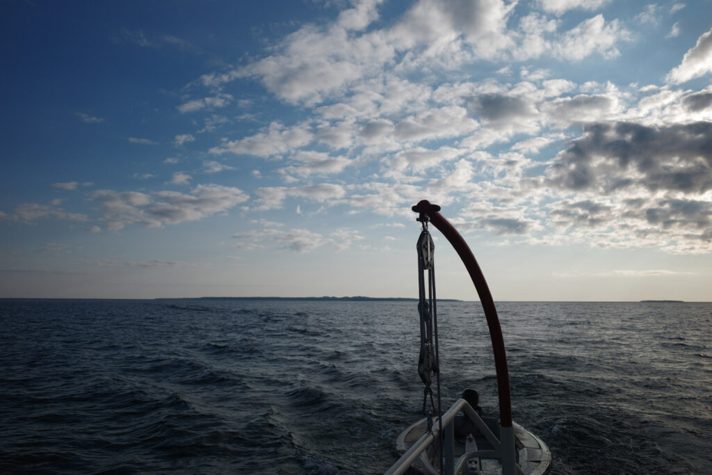 boating towards high island with ruins
