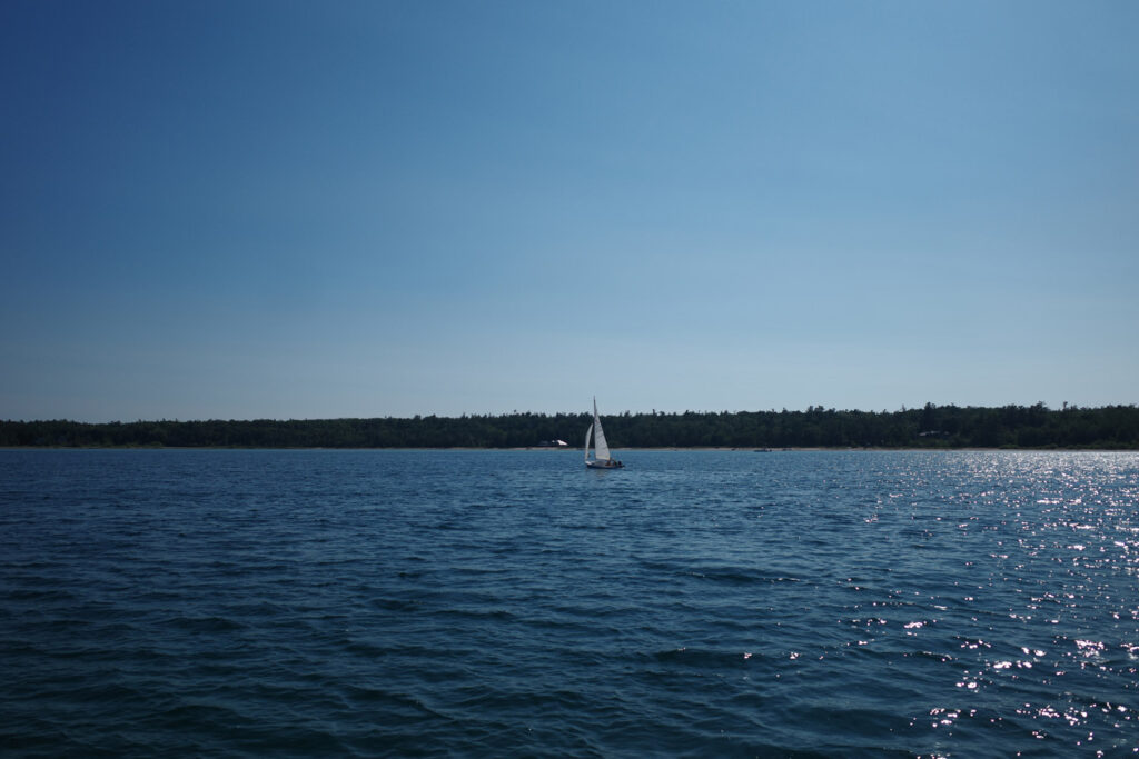 boating towards high island with ruins
