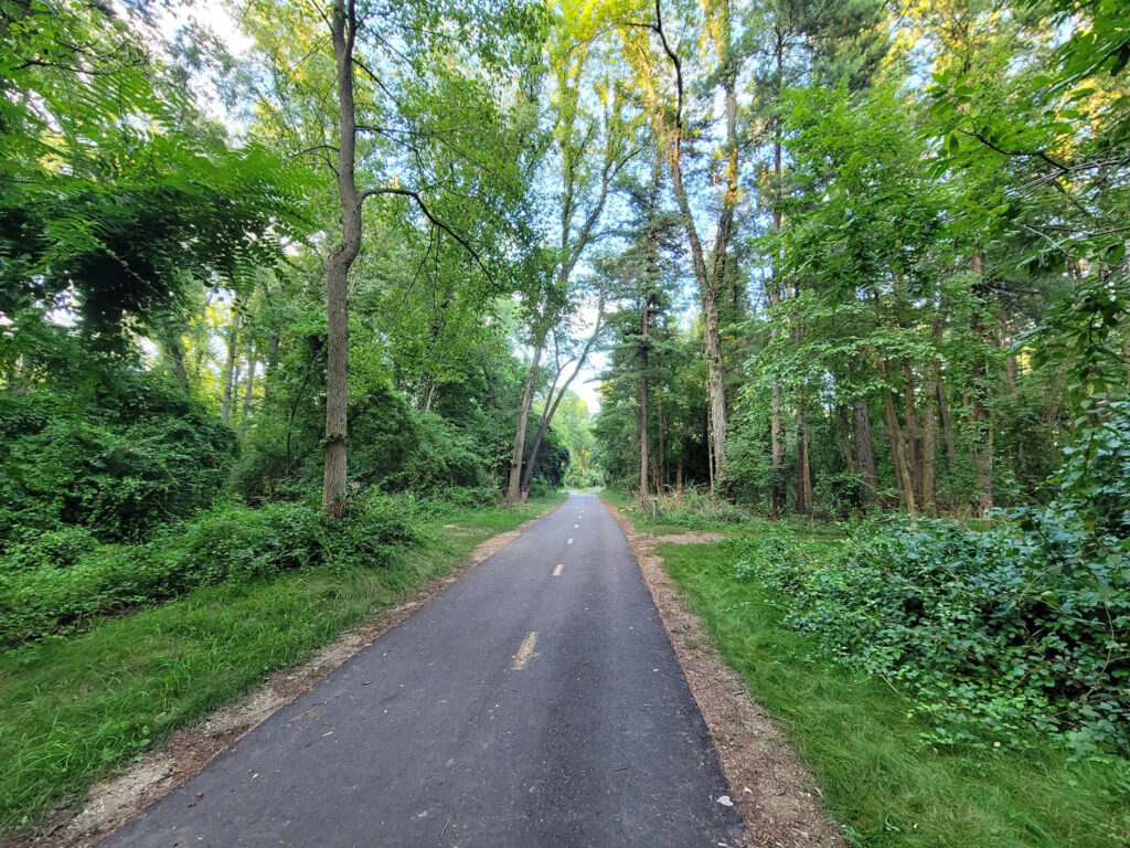Lansing trail system with homeless encampments and graffiti