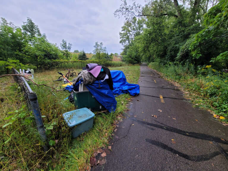 Lansing trail system with homeless encampments and graffiti