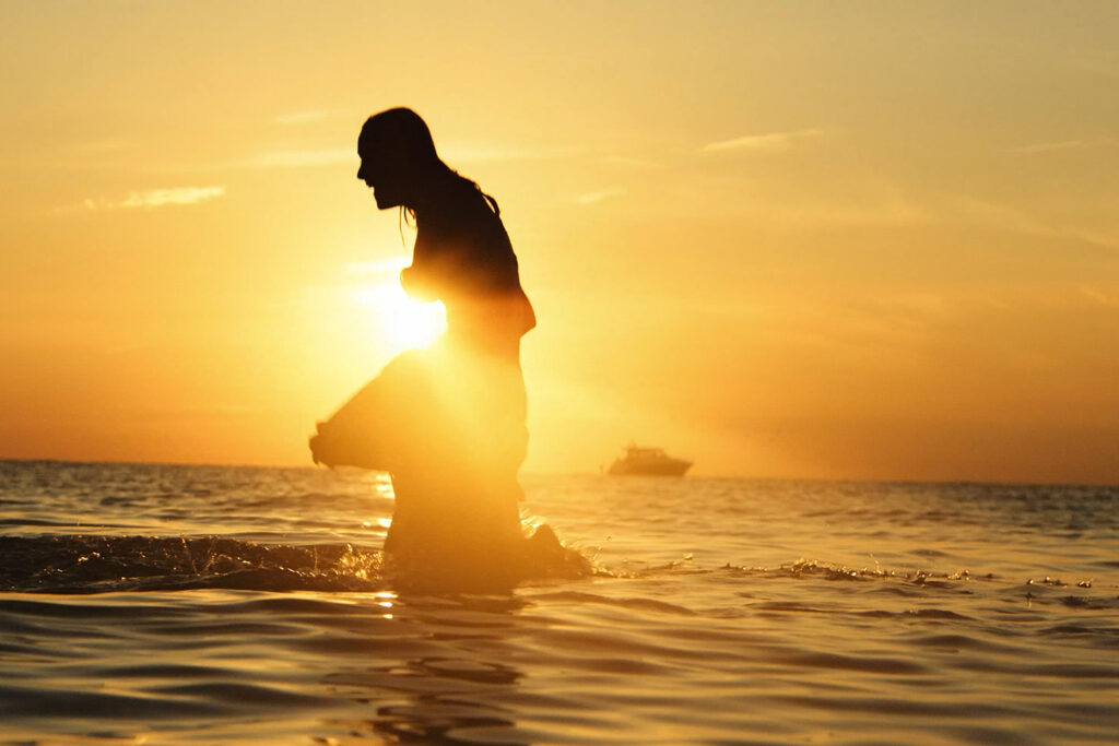 swimming at sunset