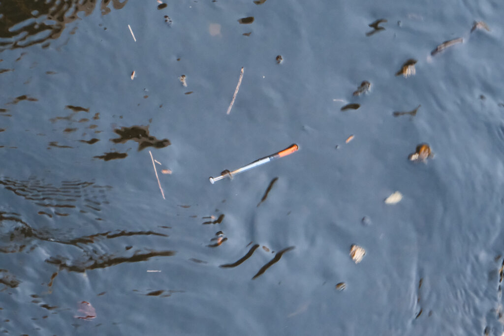 lansing fish ladder with needles and graffiti and trash