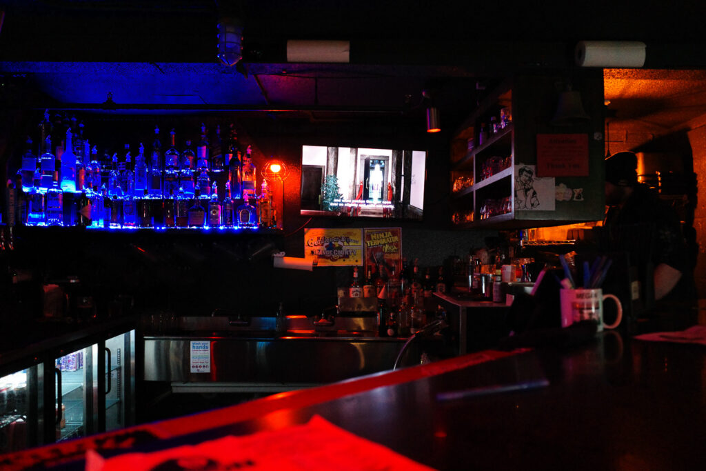 movie screening in bar with people and drinks