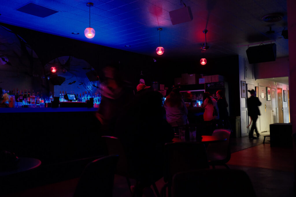 movie screening in bar with people and drinks