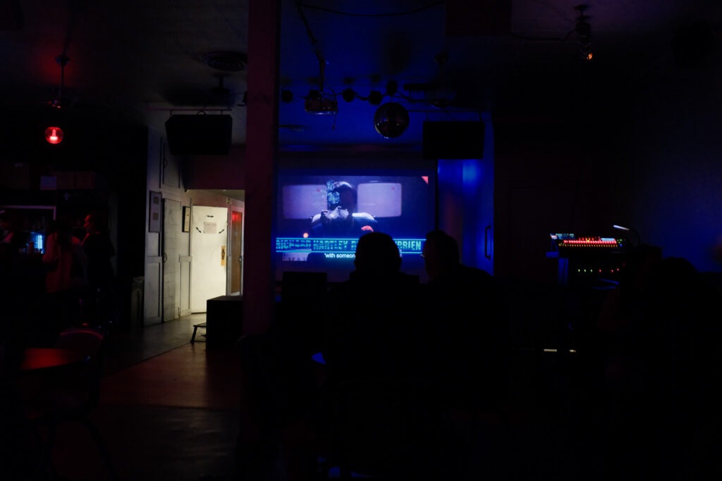 movie screening in bar with people and drinks