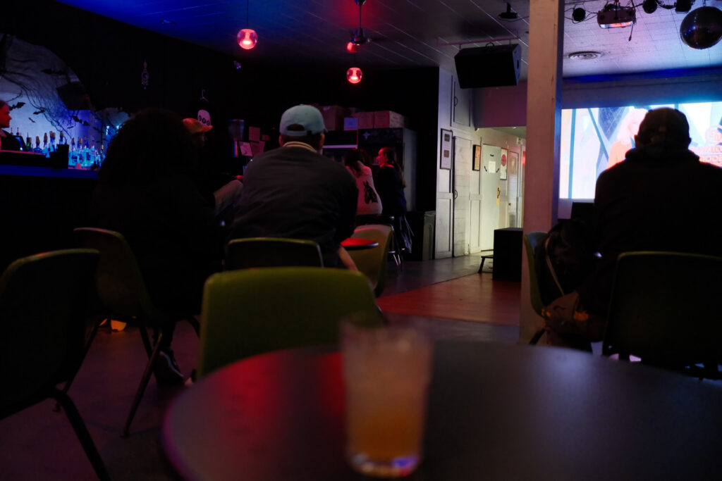 movie screening in bar with people and drinks