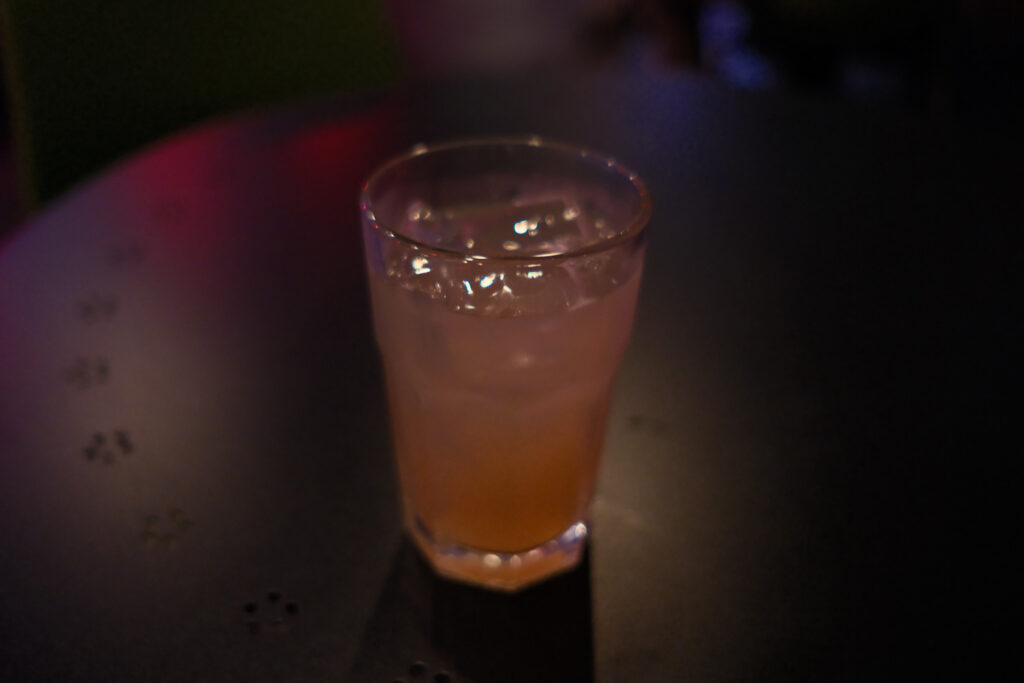 movie screening in bar with people and drinks