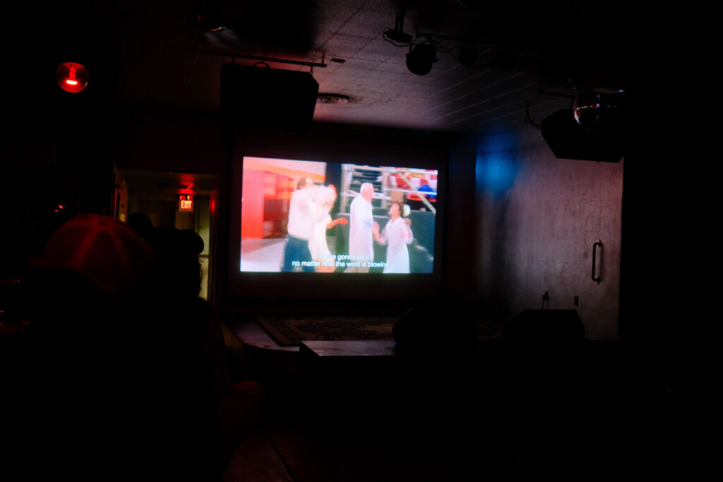 movie screening in bar with people and drinks