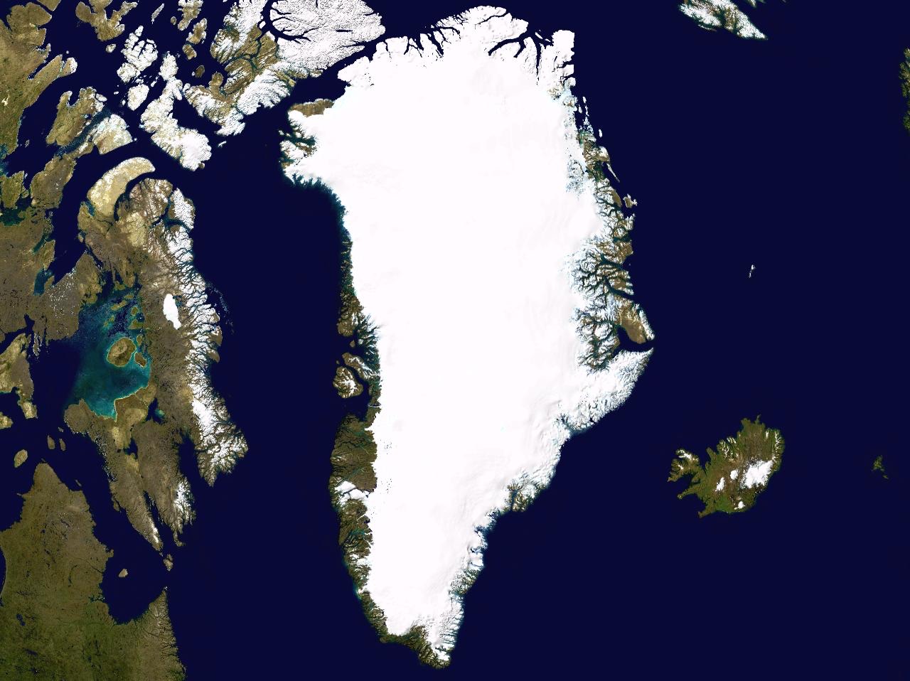 Satellite image of the expansive Greenland ice sheet, with its rugged, snow-capped landscape spanning across the northern Atlantic Ocean.